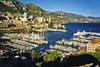 A view of Monte Carlo with the Port of Monaco in the foreground. The ship on the right is that of the prince of Monaco.