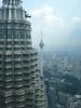 Closeup of one of the Petronas Twin Towers in Kuala Lumpur. These 88-floor towers - the tallest twin towers in the world - were completed in 1998. A two-story skybridge on the 41st and 42nd floors connects the towers and is the highest two-story bridge in the world. A double-decker elevator system is used in the towers - the bottom part for odd floors, the top part for even floors.  