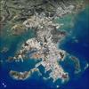 This image shows details of New Caledonia's main city, Noumea, which is built on a peninsula that juts into the lagoon on the southwest side of the island. The reefs here face problems from pollution and overfishing. The tourism industry is very important to the economy of Noumea, with extensive hotel development in the city and along the southeast coast of New Caledonia Island. The picture shows how urban development extends to the steep slopes of the coastal hills. Image courtesy of NASA.