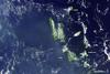 A higher-resolution view of the previous Vanuatu Archipelago image showing the two active volcanoes of Gaua and Ambrym. Vanuatu's two major islands of Espiritu Santo (top) and Malakula (bottom) appear in the center of the image. Photo courtesy of NASA.