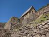 A house at the Machu Picchu ruins with a new thatched roof, modeled after the Inca roof design.