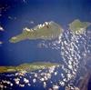 Three islands of the central Azores - spear-shaped Sao Jorge Island, Pico Island with its large volcano, and circular volcanic Faial Island - are visible in this low-oblique, southwest-looking, space shuttle photograph. Image courtesy of NASA.