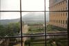 View of the gardens through a window at the El Escorial.