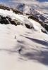 Snow, rocks, and peaks merge upward into the clouds.