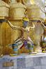 A mythological giant supports a golden chedi at the Wat Phra Kaew (Temple of the Emerald Buddha) in Bangkok.