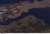 The city of Gallipoli (Gelibolu in Turkish; light gray to pink area in center of photo) sits at a crossroads between the Sea of Marmara (to the right) and the Dardanelles Strait (which leads to the Aegean Sea). Water in the Strait flows in both northeast and southwest directions due to opposite surface and undercurrents. Several ships are visible in the Strait to the southwest of Gallipoli (center left). Image courtesy of NASA.