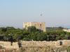 View of the restored castle on Pigeon Island (Guvercin Adasi) in the harbor of Kusadasi. The fortress was the center of the town&apos;s activities in the late 19th century. 