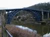 Iron Bridge spans the Severn River near the town of Ironbridge, England; it was the first arch bridge made of cast iron. Constructed in 1779, the bridge opened in 1781; vehicular traffic was barred from it in 1934. 