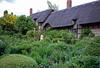 Anne Hathaway's Cottage, near Stratford-on-Avon, England, is a spacious 12-room house where Anne - Shakespeare's wife - was brought up.