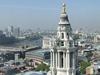 A vista of London from the Golden Gallery, the highest point of the outer dome of St. Paul's Cathedral in London. Some 85 m (280 ft) above the city, this view requires a climb of 530 steps. The large structure on the right is the cathedral's west end clock tower.