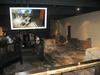 Foundational remains of some of the buildings at Aquae Sulis. The screen shows what the area looked like in Roman times.