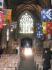 Heraldic flags flank the Preston Aisle inside Saint Giles Cathedral, Edinburgh.