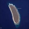 Howland Island is an uninhabited coral island located just north of the equator in the central Pacific Ocean, about 3,100 km southwest of Honolulu - almost halfway between Hawaii and Australia. The island is composed of coral fragments and is surrounded by an active fringing reef. White breakers encircling the island indicate the position of the reef. Image courtesy of NASA.