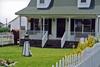 Tangier Island, Virginia is located in the lower Chesapeake Bay. This house is typical of the local architecture. House facades generally display white siding, while shutters and roofs are of matching colors.