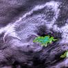 As the westernmost point in North America, Attu is a rugged island dominated by snow-covered mountains (blue in this false-color photo). It is 32 by 56 km (20 by 35 mi) and lies at the far western end of the Aleutian chain, approximately 1770 km (1100 mi) from the Alaskan mainland and 402 km (250 mi) from the Siberian coastline. The weather is characterized by persistently overcast skies, fog, high winds, and frequent cyclonic storms. The Japanese invaded and occupied Attu in June 1942. Today, the island is home to a US Coastguard station and is a sanctuary to many of North America&apos;s rarest birds. Image courtesy of NASA.
