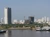 View of Ho Chi Minh City (aka Saigon) from the Saigon River. Saigon is Vietnam's major port and, with 8 million inhabitants, its largest city. It was called Saigon until 1975 when it was renamed Ho Chi Minh City following its capture by North Vietnamese communist forces. Although the city's commercial core is officially called Saigon, the entire city is widely referred to as Saigon even in the North. The city was architecturally influenced by the French during their colonial occupation of Vietnam. Numerous classical Western-style building in the city reflect this, so much so that Saigon was referred to as "The Pearl of the Far East" or "Paris in the Orient." In more recent years, a building boom has transformed the skyline of the city.